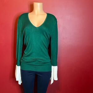 Green sweater with detailed sleeves